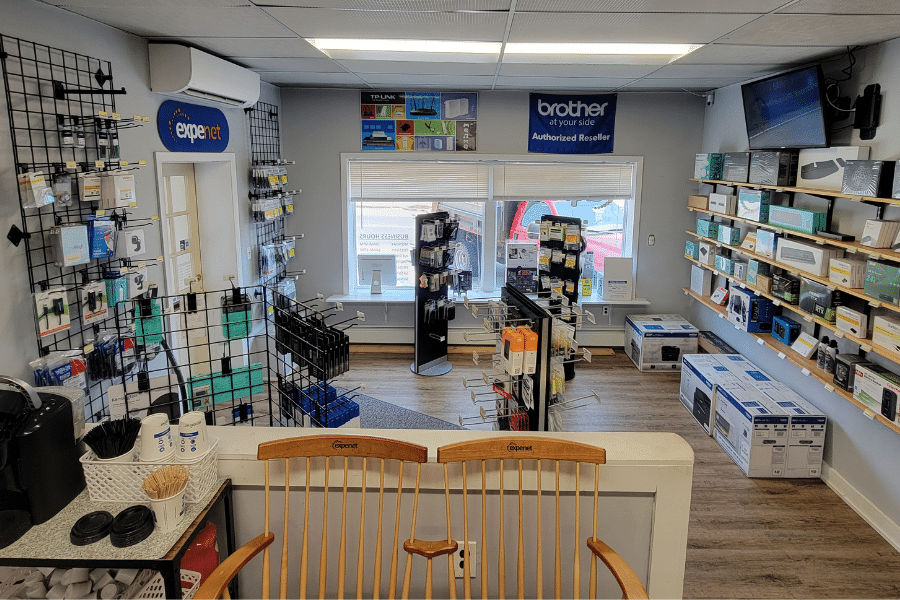 interior of the Expenet Farmington Shop. Store racks filled with IT merchandise.